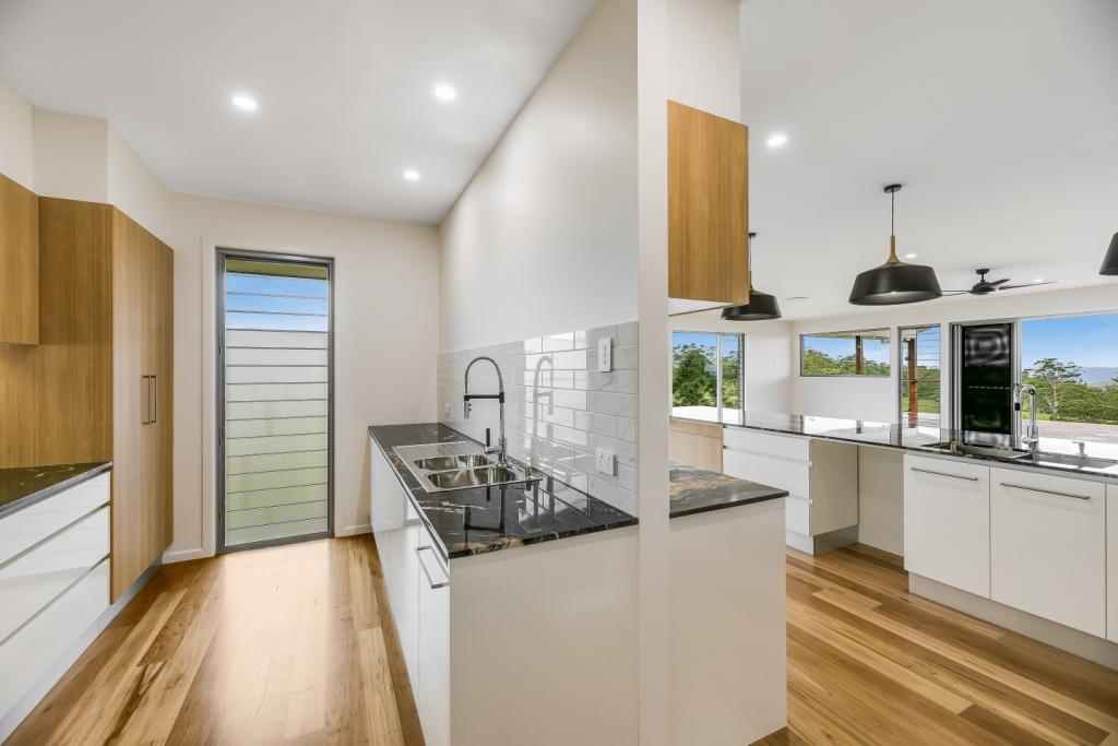 A mix of clear glass and frosted glass blades provide views and privacy in the butlers pantry