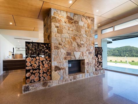 Featured fireplace with Breezway louvres in the distance
