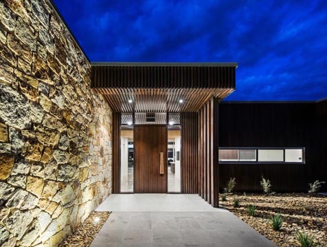 Front entry at night showing Breezway louvres up high
